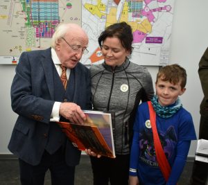 Michael D Higgins, with a copy of 'Tapestry of Light'